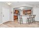 Open kitchen with stainless steel appliances, breakfast bar, and modern lighting at 14451 San Paolo Ln, Charlotte, NC 28277