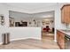 Open living area with dining view, light wood flooring, and neutral paint at 14451 San Paolo Ln, Charlotte, NC 28277
