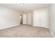 Spacious bedroom with neutral carpet, complemented by closet doors and natural light through an open doorway at 14911 Taggert Trail Dr, Charlotte, NC 28273