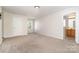 Spacious bedroom with neutral carpet, ample natural light, and an ensuite bathroom at 14911 Taggert Trail Dr, Charlotte, NC 28273