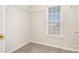 Small, walk-in closet with wire shelving and a window for natural light at 14911 Taggert Trail Dr, Charlotte, NC 28273