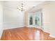 Spacious dining room with hardwood floors, a bay window, and modern light fixture at 14911 Taggert Trail Dr, Charlotte, NC 28273
