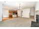 Inviting living space with a fireplace and an open view of the kitchen area at 14911 Taggert Trail Dr, Charlotte, NC 28273
