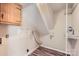 An unfinished basement space with vinyl flooring and shelving at 1506 Union New Hope Rd, Gastonia, NC 28056
