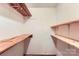Unfinished basement storage with wooden shelving units at 1506 Union New Hope Rd, Gastonia, NC 28056