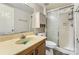 Bathroom featuring a vanity, toilet, and shower with sliding glass doors at 1506 Union New Hope Rd, Gastonia, NC 28056