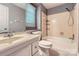 Full bathroom with tub and shower, single sink vanity, and a window providing natural light at 1506 Union New Hope Rd, Gastonia, NC 28056
