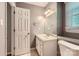 Well-lit bathroom featuring a single sink vanity, mirror, and window at 1506 Union New Hope Rd, Gastonia, NC 28056