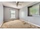 Carpeted bedroom featuring natural light from two windows at 1506 Union New Hope Rd, Gastonia, NC 28056