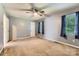 Bedroom featuring neutral carpeting, a ceiling fan, and two windows for plenty of natural light at 1506 Union New Hope Rd, Gastonia, NC 28056