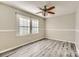Bedroom with wood-look flooring, natural light, and a ceiling fan at 1506 Union New Hope Rd, Gastonia, NC 28056
