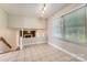 Bright dining room with tile floor, large windows, and open access to the lower level at 1506 Union New Hope Rd, Gastonia, NC 28056