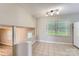 Open-concept dining room features tile floors, bright lighting, and access to outdoor at 1506 Union New Hope Rd, Gastonia, NC 28056