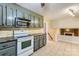 Kitchen with updated appliances and cabinetry with views to the living area at 1506 Union New Hope Rd, Gastonia, NC 28056