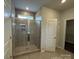 Bathroom with a large walk-in shower featuring a glass enclosure and tile surround at 156 Ella Claire Dr, York, SC 29745