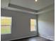 Bedroom featuring tray ceilings and two windows that bring in lots of natural light at 156 Ella Claire Dr, York, SC 29745