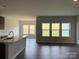 Open-concept kitchen and dining area with lots of natural light from large windows at 156 Ella Claire Dr, York, SC 29745