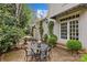 Private brick patio with outdoor seating and lush landscaping at 1579 Queens W Rd, Charlotte, NC 28207