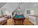 Charming game room featuring a pool table and cozy seating, perfect for entertaining guests at 1579 Queens W Rd, Charlotte, NC 28207