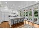 Bright, modern kitchen with large island, chef's appliances, and backyard access at 1579 Queens W Rd, Charlotte, NC 28207
