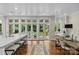 Modern kitchen with seating island, stainless appliances and backyard access at 1579 Queens W Rd, Charlotte, NC 28207