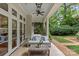 Comfortable patio with seating and ceiling fan, perfect for relaxation and outdoor living at 1579 Queens W Rd, Charlotte, NC 28207