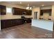 Modern kitchen with dark cabinets, stainless steel appliances, and a large center island at 160 Ella Claire Dr, York, SC 29745