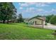 Sprawling backyard featuring a covered porch and brick supports at 1658 Buckingham Ave, Gastonia, NC 28054
