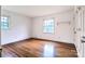 Bedroom with hardwood floors, and two windows at 1658 Buckingham Ave, Gastonia, NC 28054
