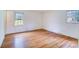 Bedroom featuring hardwood floors with a window and white walls at 1658 Buckingham Ave, Gastonia, NC 28054