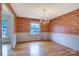 Elegant dining room featuring hardwood floors and a decorative chandelier at 1658 Buckingham Ave, Gastonia, NC 28054