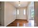 Bright foyer with hardwood floors, a coat closet, and a view to the front door at 1658 Buckingham Ave, Gastonia, NC 28054