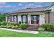 Inviting front entrance with brick steps, decorative railing, and manicured landscaping at 1658 Buckingham Ave, Gastonia, NC 28054