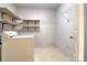 Laundry room with utility sink, shelving, and flooring at 1658 Buckingham Ave, Gastonia, NC 28054