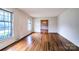 Bright living room featuring hardwood floors and large windows for natural light at 1658 Buckingham Ave, Gastonia, NC 28054