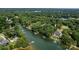 Waterfront property showcasing an estate with private docks and lush green landscaping along the shoreline at 176 Windwood Ln, Troutman, NC 28166