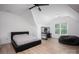 Upstairs bedroom featuring hardwood floors, neutral colors, and plenty of natural light at 176 Windwood Ln, Troutman, NC 28166