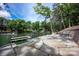 Scenic waterfront property with a dock, patio area, and lake access at 176 Windwood Ln, Troutman, NC 28166
