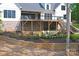 Beautiful home featuring a backyard patio, balcony, and lush landscaping at 176 Windwood Ln, Troutman, NC 28166