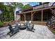 Outdoor patio with a fire pit and Adirondack chairs for cozy evenings at 176 Windwood Ln, Troutman, NC 28166