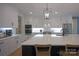 Bright kitchen with white cabinets, stainless steel appliances, and a large island with seating at 176 Windwood Ln, Troutman, NC 28166