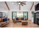 Open-concept living room with hardwood floors, sliding doors, and stylish furnishings at 176 Windwood Ln, Troutman, NC 28166