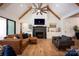Cozy living room with fireplace, exposed beams, and comfortable seating arrangement at 176 Windwood Ln, Troutman, NC 28166