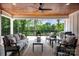 Relaxing covered patio featuring comfortable seating and a scenic view of the lush greenery at 176 Windwood Ln, Troutman, NC 28166