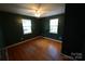 Bedroom with hardwood floors, a ceiling fan, and ample natural light at 201 W 19Th St, Kannapolis, NC 28081