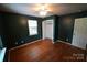 Cozy bedroom with wood floors, a ceiling fan, closet, and natural light at 201 W 19Th St, Kannapolis, NC 28081
