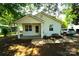 Charming bungalow-style home with a covered front porch and well-maintained yard with mature shade trees at 201 W 19Th St, Kannapolis, NC 28081