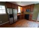 Functional kitchen featuring wood cabinets, stainless steel appliances, and wood flooring at 201 W 19Th St, Kannapolis, NC 28081