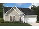 Charming one-story home with stone accents, well-manicured lawn, and attached garage at 2026 Mantle Ridge Dr, Indian Trail, NC 28079