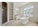 Bright, spacious bathroom features tub, shower, and double sink vanity with ample storage space at 20635 Queensdale Dr, Cornelius, NC 28031
